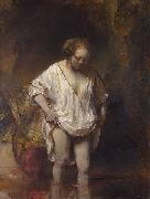 REMBRANDT Harmenszoon van Rijn A woman bathing. oil